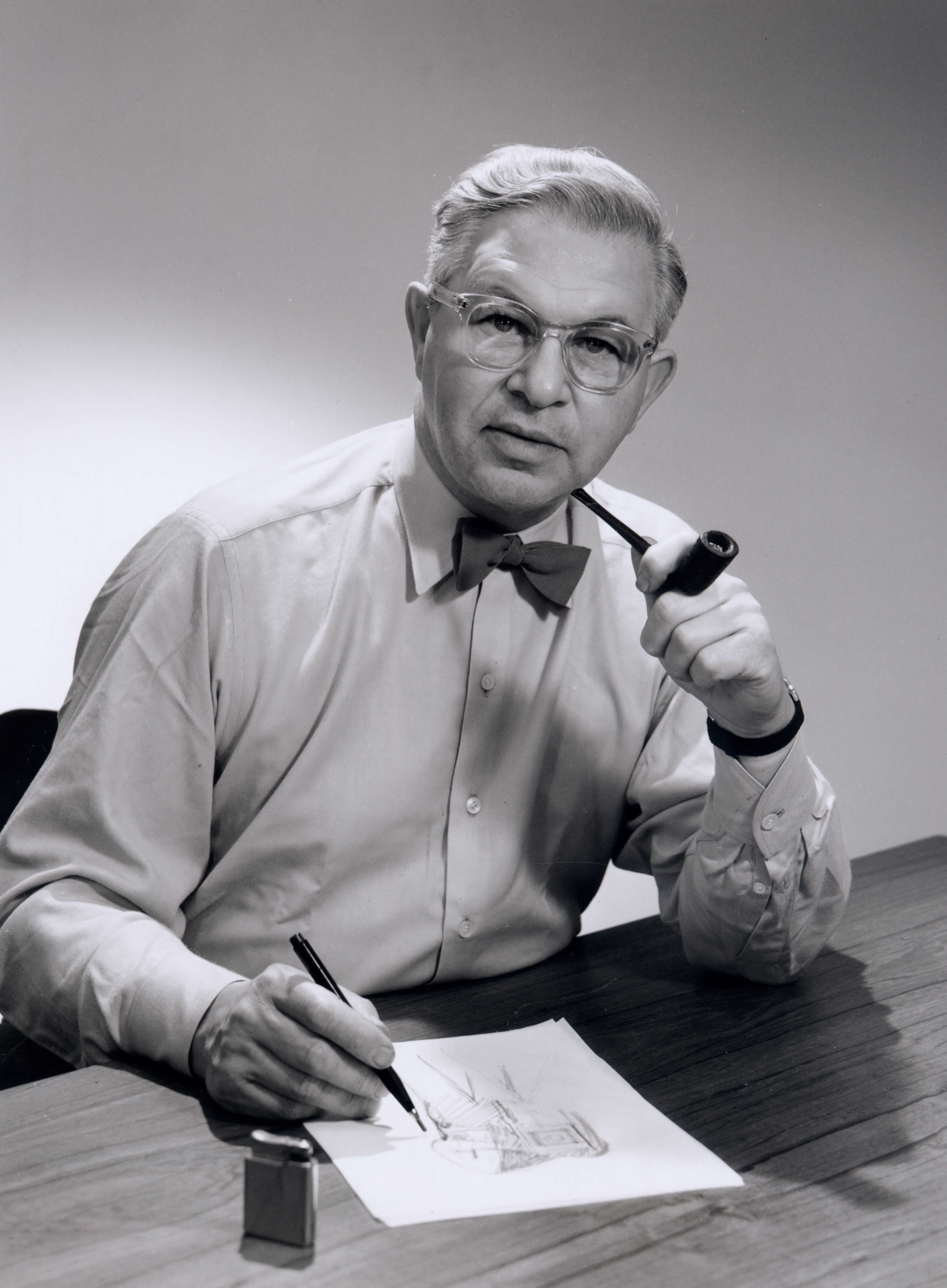Arne jacobsen with pibe and drawing